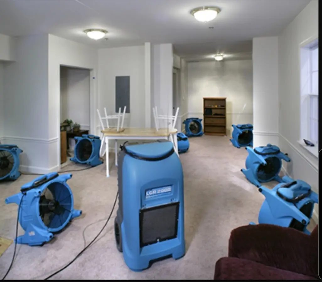 Air movers and dehumidifier setup for Water Damage Restoration in Horace